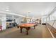 Spacious game room featuring a pool table, seating area, and fitness equipment, perfect for relaxation and recreation at 252 N Pennsylvania St # 102, Denver, CO 80203