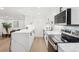 Bright kitchen with quartz countertops, stainless steel appliances, and an adjacent dining area at 252 N Pennsylvania St # 102, Denver, CO 80203