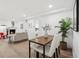 A bright living room featuring an inviting fireplace, and a dining area with stylish decor at 252 N Pennsylvania St # 102, Denver, CO 80203