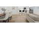Open-concept kitchen and living area with bar seating and modern appliances, great for entertaining at 252 N Pennsylvania St # 102, Denver, CO 80203