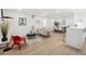 Open floor plan featuring a living room, dining area, and modern kitchen with a breakfast bar at 252 N Pennsylvania St # 102, Denver, CO 80203