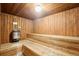 Inviting sauna room with wood paneling, multiple tiers of benches, and a heater, creating a relaxing and rejuvenating experience at 252 N Pennsylvania St # 102, Denver, CO 80203
