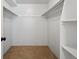 Spacious walk-in closet with ample shelving and hanging space, providing an organized storage solution for your wardrobe at 252 N Pennsylvania St # 102, Denver, CO 80203