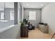 Open-concept hallway features natural light, neutral paint and comfortable work space at 11307 Navajo Cir # A, Westminster, CO 80234
