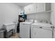 Spacious laundry room equipped with Maytag washer, dryer, and a utility sink at 11307 Navajo Cir # A, Westminster, CO 80234