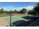 Community tennis courts with a green court and black fence at 11307 Navajo Cir # A, Westminster, CO 80234
