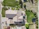 This home features a well-maintained backyard with an outdoor kitchen and in-ground trampoline at 703 Tiger Lily Way, Highlands Ranch, CO 80126