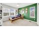 Bright bedroom with bookshelves, two windows, and a themed decor at 703 Tiger Lily Way, Highlands Ranch, CO 80126