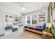 Bright bedroom with bookshelves, two windows, and a themed decor at 703 Tiger Lily Way, Highlands Ranch, CO 80126