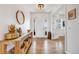 Inviting entryway featuring hardwood floors and a decorative console table with elegant accents at 703 Tiger Lily Way, Highlands Ranch, CO 80126