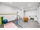 Bright playroom area ideal for various activities with room for toys and gymnastic equipment at 703 Tiger Lily Way, Highlands Ranch, CO 80126