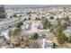 Wide aerial shot of the neighborhood, showcasing street access, trees, and other homes nearby at 2754 S Kenton Ct, Aurora, CO 80014