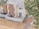 Cozy backyard with a white picket fence, brick chimney, and sliding glass door access to the home at 2754 S Kenton Ct, Aurora, CO 80014