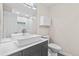 Bathroom with modern vessel sink on gray vanity, mosaic backsplash, and tiled shower with black frame at 2754 S Kenton Ct, Aurora, CO 80014