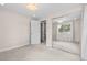 Neutral bedroom features a chandelier, neutral carpet, and large closet with mirrored sliding doors at 2754 S Kenton Ct, Aurora, CO 80014