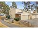 Charming townhome featuring an attached garage and well-maintained landscaping at 2754 S Kenton Ct, Aurora, CO 80014