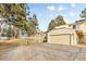 Townhome exterior featuring attached garage, neutral tones, and manicured lawns at 2754 S Kenton Ct, Aurora, CO 80014