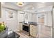 Bright kitchen features black granite countertops and stainless steel appliances at 2754 S Kenton Ct, Aurora, CO 80014