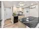 Bright kitchen features black granite countertops and stainless steel appliances at 2754 S Kenton Ct, Aurora, CO 80014