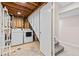 Basement laundry room with washer, dryer, and utility sink at 2754 S Kenton Ct, Aurora, CO 80014