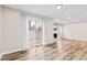 Bright, open space with sliding doors, hardwood floors, and fireplace in view at 2754 S Kenton Ct, Aurora, CO 80014