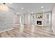 Bright living room featuring hardwood floors, fireplace, and sliding door access at 2754 S Kenton Ct, Aurora, CO 80014