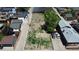 Aerial view of the level vacant lot between residential houses, an ideal build site with neighborhood garages at 1735 W 37Th, Denver, CO 80211