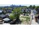 A vacant lot surrounded by greenery and modern homes, offering an investment opportunity in a vibrant neighborhood at 1735 W 37Th, Denver, CO 80211
