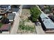 An aerial view shows the vacant lot among homes with garages and driveways at 1735 W 37Th, Denver, CO 80211