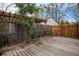 Fenced back deck with pergola, perfect for outdoor relaxation and entertaining at 4906 E Bates Ave, Denver, CO 80222