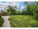 Spacious backyard with healthy grass and a stone patio, perfect for entertaining at 4906 E Bates Ave, Denver, CO 80222