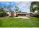 Expansive backyard with patio and mature trees, offering privacy and space at 4906 E Bates Ave, Denver, CO 80222