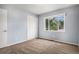 Bright bedroom with a large window and a spacious closet at 4906 E Bates Ave, Denver, CO 80222