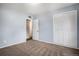 Bright bedroom with a closet for storage and easy access to an ensuite bathroom at 4906 E Bates Ave, Denver, CO 80222