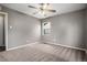 Comfortable bedroom with neutral tones, carpet flooring and a ceiling fan at 4906 E Bates Ave, Denver, CO 80222