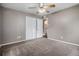 This bedroom includes a large closet and a view into the bathroom at 4906 E Bates Ave, Denver, CO 80222