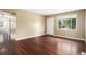 Living room featuring beautiful hardwood floors and window with natural light at 4906 E Bates Ave, Denver, CO 80222