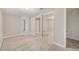 Finished basement featuring neutral carpeting and well-lit open space to other basement rooms at 1920 Elmira St, Aurora, CO 80010