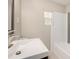 Modern bathroom with white, subway-tiled shower and white vessel sink, topped with modern faucet at 1920 Elmira St, Aurora, CO 80010