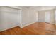 Bedroom with hardwood flooring, closet, and neutral-colored paint at 1920 Elmira St, Aurora, CO 80010