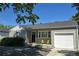 Well-kept home exterior with an attached garage and inviting front porch seating at 1920 Elmira St, Aurora, CO 80010