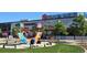 Charming exterior featuring the Stanley Marketplace sign and park benches, perfect for enjoying the outdoors at 1920 Elmira St, Aurora, CO 80010