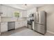 Modern kitchen with stainless steel appliances, white cabinets, granite countertops and subway tile backsplash at 1920 Elmira St, Aurora, CO 80010