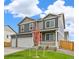 Beautiful home exterior featuring a well-manicured lawn, two car garage, and welcoming porch at 4331 Gypsum Ave, Mead, CO 80504