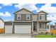 Charming two-story home featuring a two car garage and inviting front porch at 4331 Gypsum Ave, Mead, CO 80504