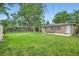 Large backyard with patio and storage shed at 5820 S Cherokee St, Littleton, CO 80120