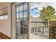 View from balcony with railing looking out on neighborhood with trees and nearby buildings at 3866 S Dallas Cir # 12202, Aurora, CO 80014