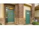 Close-up of the entrance doors, showing the brick and stone construction at 3866 S Dallas Cir # 12202, Aurora, CO 80014