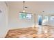 Living room features a large window, light wood floors, light walls and sliding glass doors to the balcony at 3866 S Dallas Cir # 12202, Aurora, CO 80014