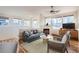 Bright living room features a fireplace, large windows, modern furniture, and wood-look floors at 3866 S Dallas Cir # 12202, Aurora, CO 80014